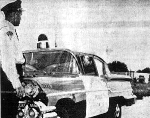 Willis Jacob with a cop car