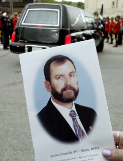 Philip Shrive headshot with his hearse in the background